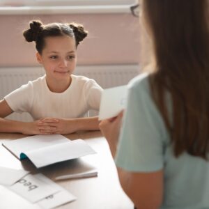 psychologist-helping-little-girl-speech-therapy (1)